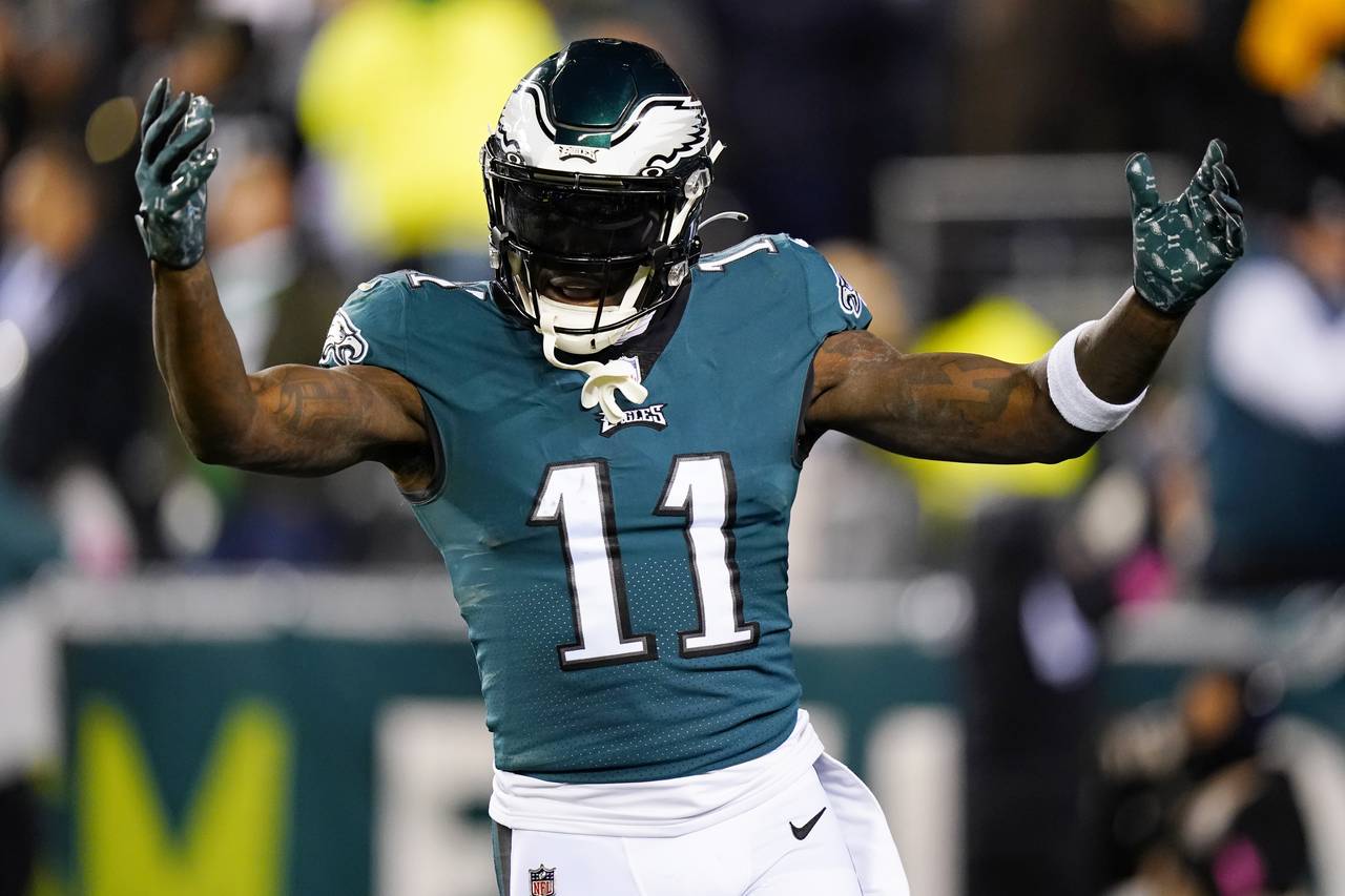 Philadelphia Eagles wide receiver A.J. Brown reacts after teammate Boston Scott scored on a touchdo...