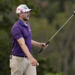 
              Mackenzie Hughes acknowledges the gallery after his shot on the 17th green during the first round of the Tournament of Champions golf event, Thursday, Jan. 5, 2023, at Kapalua Plantation Course in Kapalua, Hawaii. (AP Photo/Matt York)
            