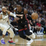 
              Miami Heat guard Victor Oladipo (4) drives to the basket against Milwaukee Bucks guard Jevon Carter during the first half of an NBA basketball game, Thursday, Jan. 12, 2023, in Miami. (AP Photo/Wilfredo Lee)
            
