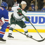
              Minnesota Wild left wing Kirill Kaprizov shoots the puck to score past New York Rangers defenseman Jacob Trouba (8) during the first period of an NHL hockey game, Tuesday, Jan. 10, 2023, at Madison Square Garden in New York. (AP Photo/Mary Altaffer)
            