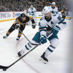 
              San Jose Sharks' Erik Karlsson clears the puck before Pittsburgh Penguins' Sidney Crosby  can get to it during the second period of an NHL hockey game in Pittsburgh, Saturday, Jan. 28, 2023. (AP Photo/Gene J. Puskar)
            