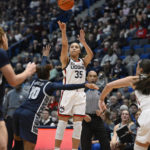 
              UConn's Azzi Fudd (35) shoots a 3-point basket in the first half of an NCAA college basketball game against Georgetown, Sunday, Jan. 15, 2023, in Hartford, Conn. (AP Photo/Jessica Hill)
            