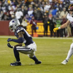 
              Dallas Cowboys wide receiver CeeDee Lamb (88) drops a pass while being covered by Washington Commanders linebacker David Mayo (51) during the first half an NFL football game, Sunday, Jan. 8, 2023, in Landover, Md. (AP Photo/Alex Brandon)
            