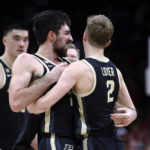 
              Purdue guard Ethan Morton, front left, celebrates with guard Fletcher Loyer following the team's win over Ohio State in an NCAA college basketball game in Columbus, Ohio, Thursday, Jan. 5, 2023. (AP Photo/Paul Vernon)
            
