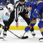 
              Seattle Kraken center Morgan Geekie (67) and Buffalo Sabres center Tage Thompson (72) battle for the puck during a faceoff during the second period of an NHL hockey game, Tuesday, Jan. 10, 2023, in Buffalo, N.Y. (AP Photo/Jeffrey T. Barnes)
            
