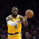 
              Los Angeles Lakers' LeBron James (6) passes the ball during the first half of an NBA basketball game against the Houston Rockets, Monday, Jan. 16, 2023, in Los Angeles. (AP Photo/Jae C. Hong)
            
