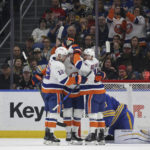 
              New York Islanders right wing Josh Bailey (12), center Brock Nelson (29) and left wing Anthony Beauvillier (18) celebrate after a goal by Nelson against the Buffalo Sabres during the first period of an NHL hockey game Thursday, Jan. 19, 2023, in Buffalo, N.Y. (AP Photo/Joshua Bessex)
            