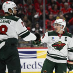 
              Minnesota Wild defenseman Jared Spurgeon (46) celebrates his goal with Minnesota Wild left wing Jordan Greenway (18) during the second period of an NHL hockey game against the Washington Capitals, Tuesday, Jan. 17, 2023, in Washington. (AP Photo/Nick Wass)
            