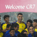 
              Cristiano Ronaldo smiles during his official unveiling as a new member of Al Nassr soccer club in in Riyadh, Saudi Arabia, Tuesday, Jan. 3, 2023.Ronaldo, who has won five Ballon d'Ors awards for the best soccer player in the world and five Champions League titles, will play outside of Europe for the first time in his storied career. (AP Photo/Amr Nabil)
            