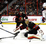 
              Columbus Blue Jackets right wing Kirill Marchenko (86) jumps as he skates through the crease of Ottawa Senators goaltender Anton Forsberg (31), as he makes a save during the first period of an NHL hockey game, Tuesday, Jan. 3, 2023 in Ottawa, Ontario. (Justin Tang/The Canadian Press via AP)
            