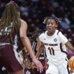 
              South Carolina guard Talaysia Cooper (11) drives against Texas A&M forward Aaliyah Patty during the second half of an NCAA college basketball game in Columbia, S.C., Thursday, Dec. 29, 2022. South Carolina won 76-34. (AP Photo/Nell Redmond)
            