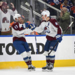 
              Colorado Avalanche's Brad Hunt (17) and Cale Makar (8) celebrate a goal against the Edmonton Oilers during the third period of an NHL hockey game Saturday, Jan. 7, 2023, in Edmonton, Alberta. (Jason Franson/The Canadian Press via AP)
            
