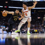 
              Toronto Raptors guard Fred VanVleet (23) drives against New York Knicks guard Quentin Grimes (6) during the first half of an NBA basketball game Friday, Jan. 6, 2023, in Toronto. (Cole Burston/The Canadian Press via AP)
            
