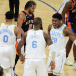 
              Los Angeles Lakers' Rui Hachimura (28), of Japan, celebrates with LeBron James (6) and Russell Westbrook (0) as New York Knicks' Jalen Brunson walks past them after James scored during the second half of an NBA basketball game Tuesday, Jan. 31, 2023, in New York. The Lakers won 129-123 in overtime. (AP Photo/Frank Franklin II)
            