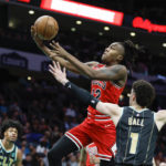 
              Chicago Bulls guard Ayo Dosunmu drives to the basket past Charlotte Hornets guard LaMelo Ball (1) during the first half of an NBA basketball game in Charlotte, N.C., Thursday, Jan. 26, 2023. (AP Photo/Nell Redmond)
            