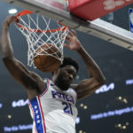 
              Philadelphia 76ers center Joel Embiid (21) dunks during the first half of an NBA basketball game against the Los Angeles Clippers in Los Angeles, Tuesday, Jan. 17, 2023. (AP Photo/Ashley Landis)
            
