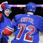
              New York Rangers left wing Artemi Panarin, left, is congratulated by Filip Chytil (72)  after scoring a goal against the Montreal Canadiens in the second period of an NHL hockey game Sunday, Jan. 15, 2023, in New York. (AP Photo/Adam Hunger)
            