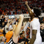 
              Oklahoma State's Woody Newton (4) celebrates with fans after the the NCAA college basketball game against Iowa State in Stillwater, Okla., Saturday, Jan. 21, 2023. (AP Photo/Mitch Alcala)
            