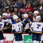 
              St. Louis Blues' Jordan Kyrou (25), Robert Thomas (18), and Pavel Buchnevich (89) celebrate with teammates after Kyrou scored a goal against the New Jersey Devils during the first period of an NHL hockey game Thursday, Jan. 5, 2023, in Newark, N.J. (AP Photo/Frank Franklin II)
            