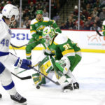 
              Minnesota Wild goaltender Filip Gustavsson (32) stops a shot by Tampa Bay Lightning defenseman Nick Perbix (48) during the second period of an NHL hockey game Wednesday, Jan. 4, 2023, in St. Paul, Minn. (AP Photo/Andy Clayton-King)
            
