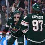
              Minnesota Wild left wing Matt Boldy, left, celebrates with left wing Kirill Kaprizov (97) after scoring a goal during the third period of an NHL hockey game against the Philadelphia Flyers, Thursday, Jan. 26, 2023, in St. Paul, Minn. (AP Photo/Abbie Parr)
            