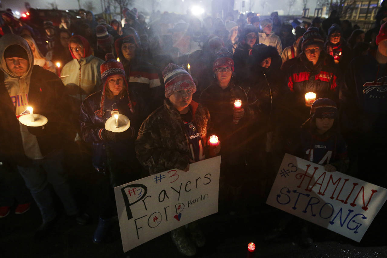 Buffalo Bills fans and community members gather for a candlelight vigil for Bills safety Damar Haml...