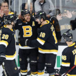 
              Boston Bruins right wing David Pastrnak, center, is congratulated by teammates Derek Forbort (28), Pavel Zacha (18), and David Krejci after scoring a goal during the first period of an NHL hockey game against the Philadelphia Flyers, Monday, Jan. 16, 2023, in Boston. (AP Photo/Mary Schwalm)
            