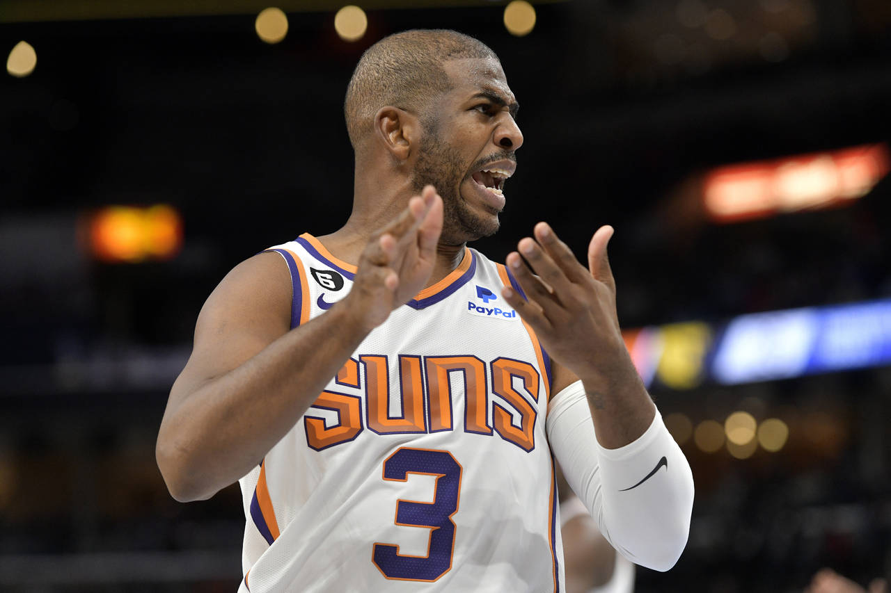 Phoenix Suns guard Chris Paul (3) reacts in the first half of an NBA basketball game against the Me...