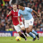 
              Manchester City's Rodrigo, right, controls the ball next to Manchester United's Christian Eriksen during the English Premier League soccer match between Manchester United and Manchester City at Old Trafford in Manchester, England, Saturday, Jan. 14, 2023. (AP Photo/Dave Thompson)
            