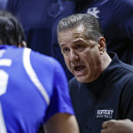 
              Kentucky head coach John Calipari talks to his players during a timeout in the first half of an NCAA college basketball game against Tennessee, Saturday, Jan. 14, 2023, in Knoxville, Tenn. (AP Photo/Wade Payne)
            