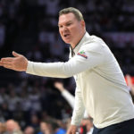
              Arizona head coach Tommy Lloyd reacts to a foul call during the first half of an NCAA college basketball game against UCLA, Saturday, Jan. 21, 2023, in Tucson, Ariz. (AP Photo/Rick Scuteri)
            