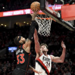 
              Toronto Raptors guard Gary Trent Jr., left, drives to the basket against Portland Trail Blazers forward Drew Eubanks during the first half of an NBA basketball game in Portland, Ore., Saturday, Jan. 28, 2023. (AP Photo/Steve Dykes)
            