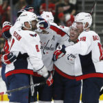 
              FILE - Washington Capitals left wing Alex Ovechkin (8) celebrates his go-ahead goal with defenseman John Carlson (74), right wing T.J. Oshie (77) and center Nicklas Backstrom (19) during the third period of an NHL hockey game against the Detroit Red Wings, Friday, Dec. 31, 2021, in Detroit. Ovechkin earlier this season became the third player in NHL history to surpass 800 career goals. Only Wayne Gretzky has scored more than Ovechkin's 810. But Ovechkin has not gotten within range of Gretzky's record of 894 goals by himself. Dozens of Washington Capitals teammates have assisted on goals by Ovechkin during his 18-year career since coming to North America.(AP Photo/Duane Burleson, File)
            