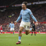 
              Manchester City's Jack Grealish celebrates after scoring his side's first goal during the English Premier League soccer match between Manchester United and Manchester City at Old Trafford in Manchester, England, Saturday, Jan. 14, 2023. (AP Photo/Dave Thompson)
            