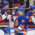 
              New York Islanders' Zach Parise (11) celebrates with teammates after scoring a goal during the first period of an NHL hockey game against the Boston Bruins Wednesday, Jan. 18, 2023, in Elmont, N.Y. (AP Photo/Frank Franklin II)
            