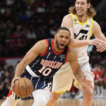 
              Houston Rockets' Eric Gordon (10) is fouled by Utah Jazz's Kelly Olynyk (41) during the first half of an NBA basketball game Thursday, Jan. 5, 2023, in Houston. (AP Photo/David J. Phillip)
            
