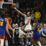 
              Minnesota Timberwolves forward Kyle Anderson (5) goes up to shoot past Denver Nuggets guard Kentavious Caldwell-Pope (5) during the second half of an NBA basketball game Monday, Jan. 2, 2023, in Minneapolis. (AP Photo/Craig Lassig)
            