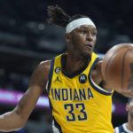 
              Indiana Pacers center Myles Turner pulls in a rebound during the first half of the team's NBA basketball game against the Denver Nuggets Friday, Jan. 20, 2023, in Denver. (AP Photo/David Zalubowski)
            