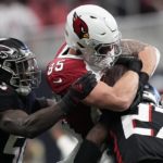 
              Arizona Cardinals tight end Trey McBride (85) is hit by Atlanta Falcons safety Richie Grant (27) during the first half of an NFL football game, Sunday, Jan. 1, 2023, in Atlanta. (AP Photo/Brynn Anderson)
            