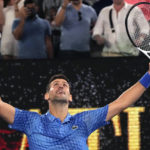 
              Novak Djokovic of Serbia celebrates after defeating Tommy Paul of the U.S. in their semifinal at the Australian Open tennis championship in Melbourne, Australia, Friday, Jan. 27, 2023. (AP Photo/Aaron Favila)
            