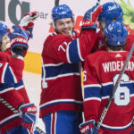 
              Montreal Canadiens' Joel Armia, right rear, celebrates with teammates after scoring against the St. Louis Blues during the second period of an NHL hockey game Saturday, Jan. 7, 2023, in Montreal. (Graham Hughes/The Canadian Press via AP)
            