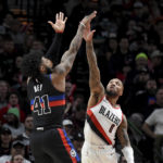 
              Portland Trail Blazers guard Damian Lillard, right, goes up block a shot by Detroit Pistons forward Saddiq Bey, left, during the first half of an NBA basketball game in Portland, Ore., Monday, Jan. 2, 2023. (AP Photo/Steve Dykes)
            