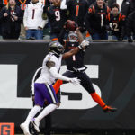 
              Cincinnati Bengals wide receiver Ja'Marr Chase (1) makes a catch over Baltimore Ravens cornerback Daryl Worley (41) for a touchdown in the first half of an NFL football game in Cincinnati, Sunday, Jan. 8, 2023. (AP Photo/Jeff Dean)
            