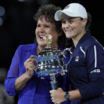 
              FILE - Ash Barty, right, of Australia, holds the Daphne Akhurst Memorial Cup as she poses for photographers with Evonne Goolagong Cawley after defeating Danielle Collins of the U.S. in the women's singles final at the Australian Open tennis championships in Melbourne, Australia, Saturday, Jan. 29, 2022. Next week, Barty won’t be defending the Australian Open title she won last January. (AP Photo/Simon Baker, File)
            