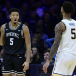 
              Providence's Ed Croswell, left reacts after a foul called during the second half of an NCAA college basketball game against Villanova, Sunday, Jan. 29, 2023, in Philadelphia. (AP Photo/Derik Hamilton)
            
