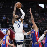 
              Minnesota Timberwolves guard D'Angelo Russell (0) shoots against the Detroit Pistons in the second half of an NBA basketball game in Detroit, Wednesday, Jan. 11, 2023. (AP Photo/Paul Sancya)
            