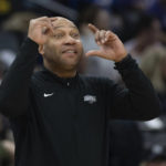 
              Los Angeles Lakers coach Marvin Ham signals to the team on the defensive end during the first half of an NBA basketball game against the Sacramento Kings in Sacramento, Calif., Saturday, Jan. 7, 2023. (AP Photo/José Luis Villegas)
            