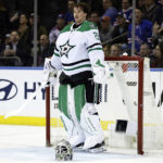 
              Dallas Stars goaltender Jake Oettinger reacts after being called for a delay of game penalty during the third period of the team's NHL hockey game against the New York Rangers on Thursday, Jan. 12, 2023, in New York. The Rangers won 2-1 in overtime. (AP Photo/Adam Hunger)
            