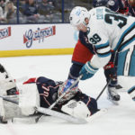 
              Columbus Blue Jackets' Joonas Korpisalo, left, makes a save against San Jose Sharks' Logan Couture during the first period of an NHL hockey game on Saturday, Jan. 21, 2023, in Columbus, Ohio. (AP Photo/Jay LaPrete)
            