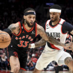 
              Toronto Raptors guard Gary Trent Jr., left, drives to the basket against Portland Trail Blazers guard Gary Payton II during the first half of an NBA basketball game in Portland, Ore., Saturday, Jan. 28, 2023. (AP Photo/Steve Dykes)
            